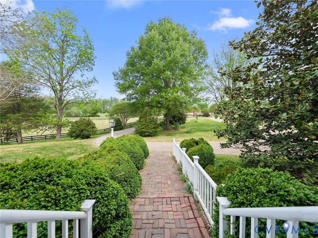 2625 Old Tavern Road Powhatan, VA 23139 - Photo 7 of 100 a view of a pathway both side of yard