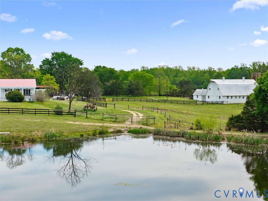 2625 Old Tavern Road Powhatan, VA 23139 - Photo 78 of 100 a view of a lake with a yard and large trees