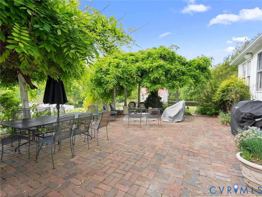 2625 Old Tavern Road Powhatan, VA 23139 - Photo 88 of 100 a view of a tables and chairs in a patio