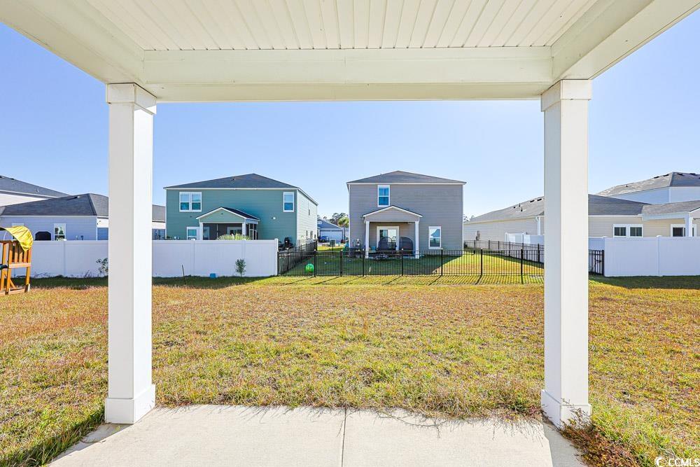 1560 Swing Bridge Way Myrtle Beach, SC 29588 - Photo 29 of 35 Fenced backyard with a patio area and a residential view