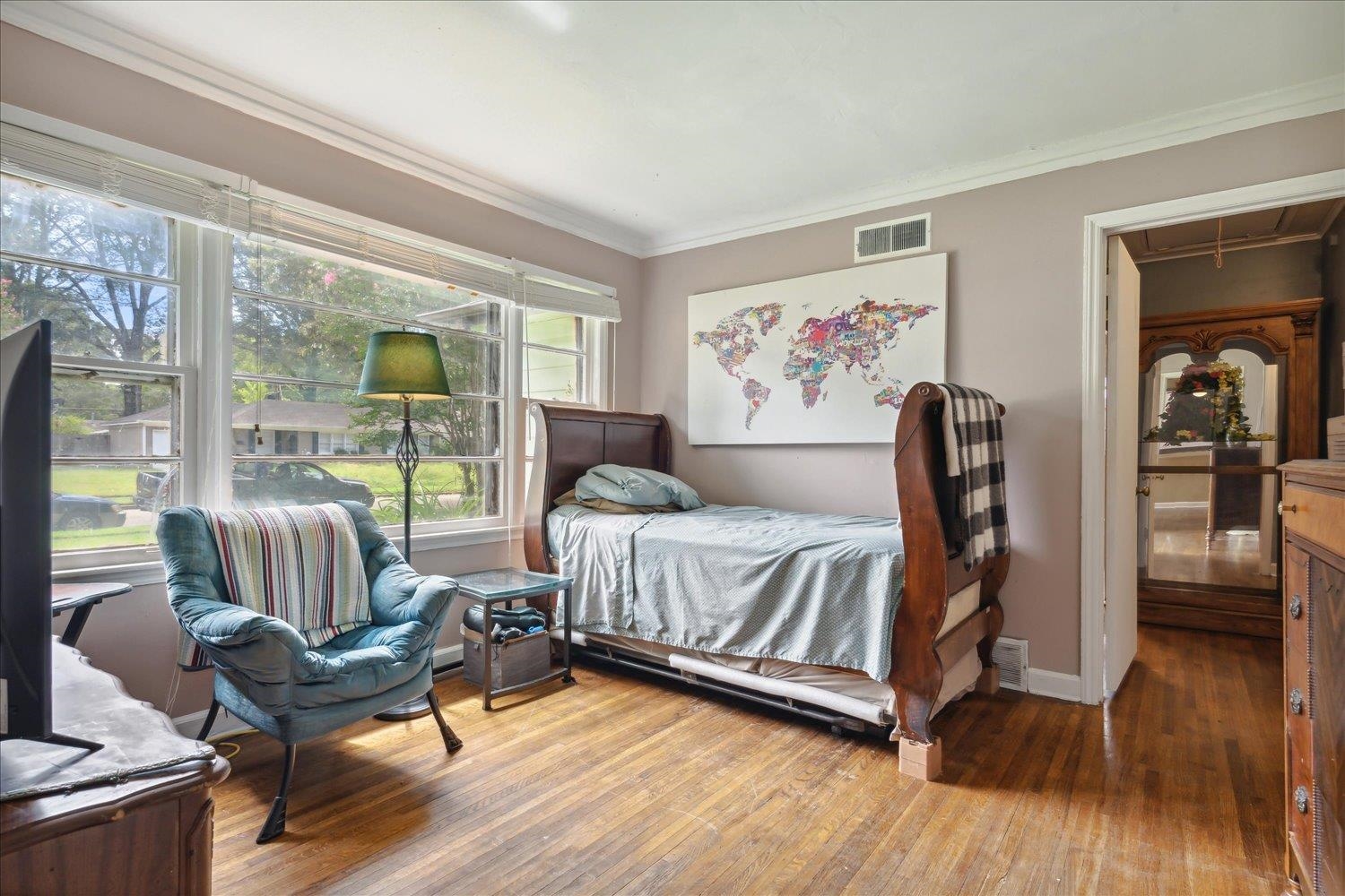 4608 Boyce Road Memphis, TN 38117 - Photo 17 of 30 a bedroom with a bed and glass door