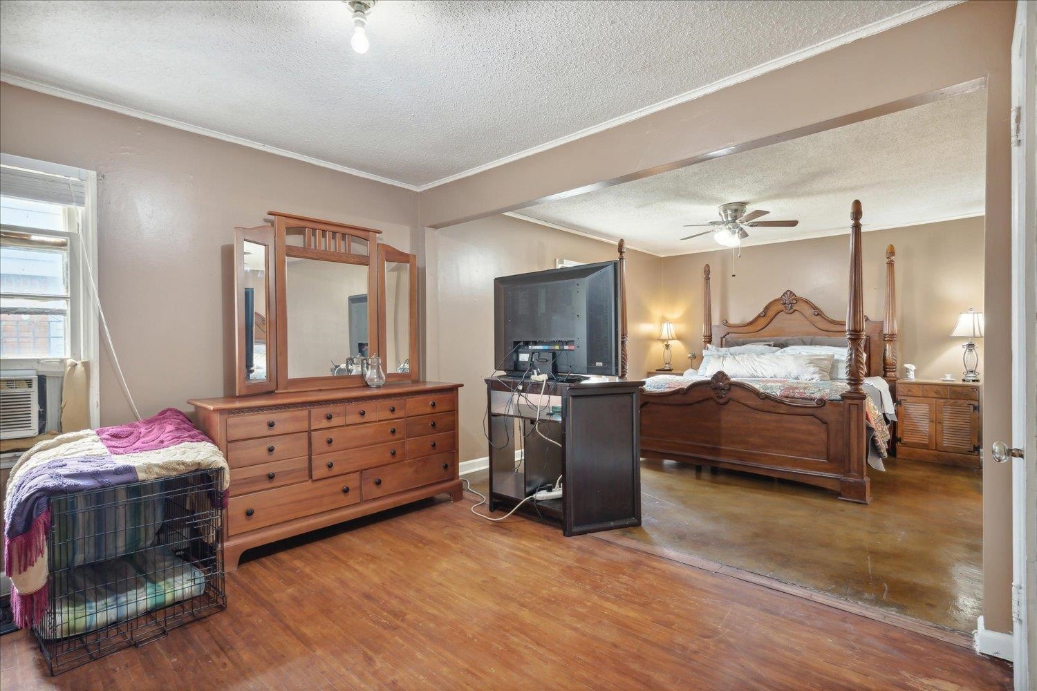 4608 Boyce Road Memphis, TN 38117 - Photo 20 of 30 a bedroom with a bed and a dresser