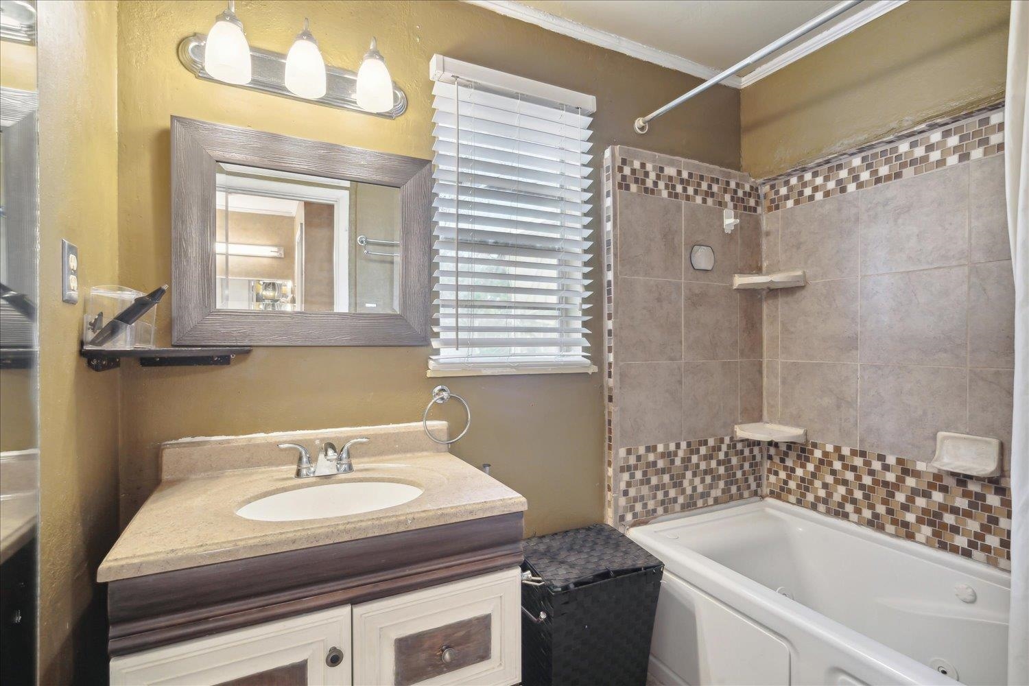 4608 Boyce Road Memphis, TN 38117 - Photo 23 of 30 a bathroom with a sink and a bathtub