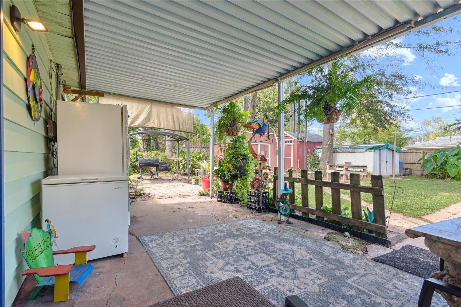 4608 Boyce Road Memphis, TN 38117 - Photo 24 of 30 a backyard of a house with garden and outdoor seating