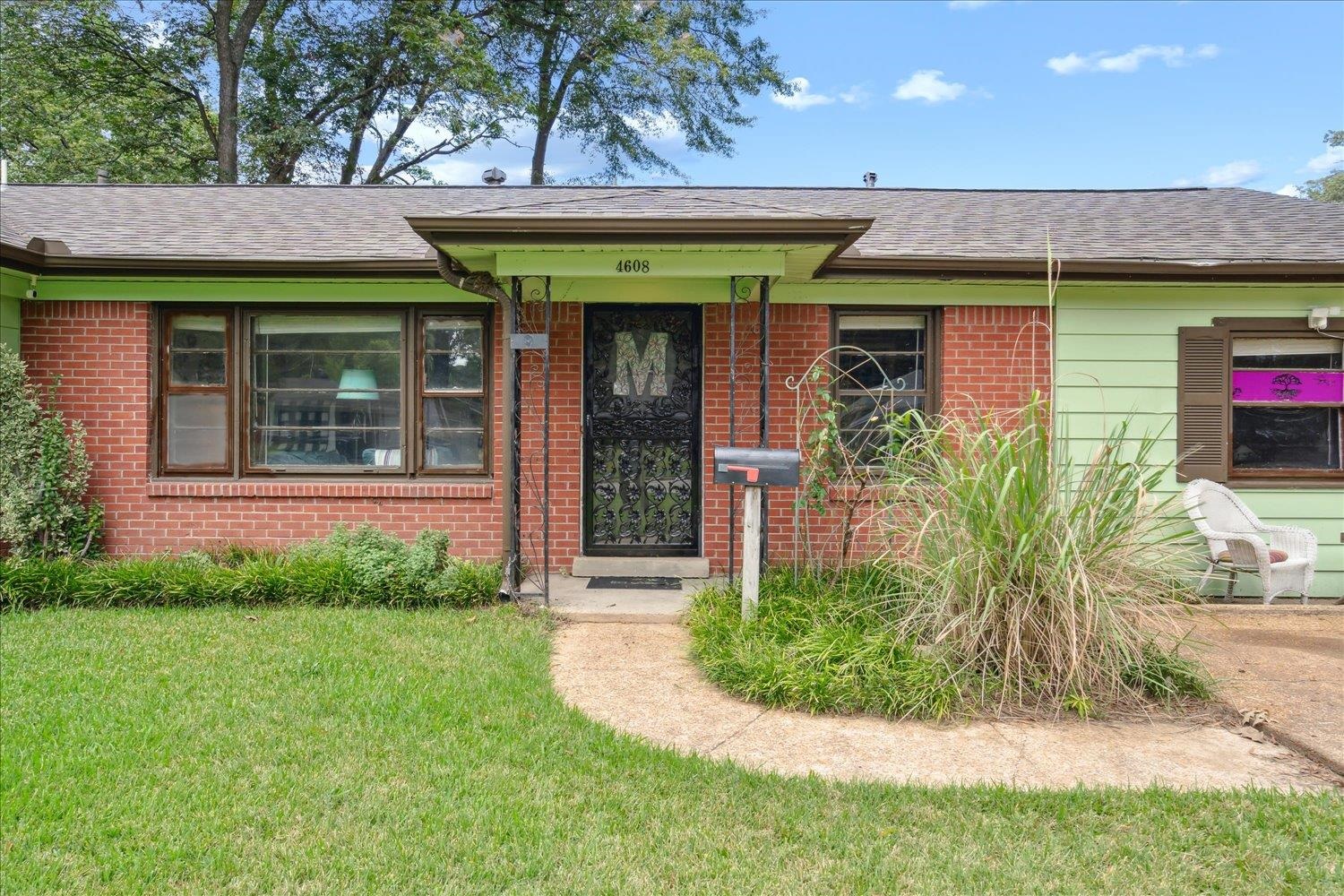 4608 Boyce Road Memphis, TN 38117 - Photo 4 of 30 a front view of a house with a garden