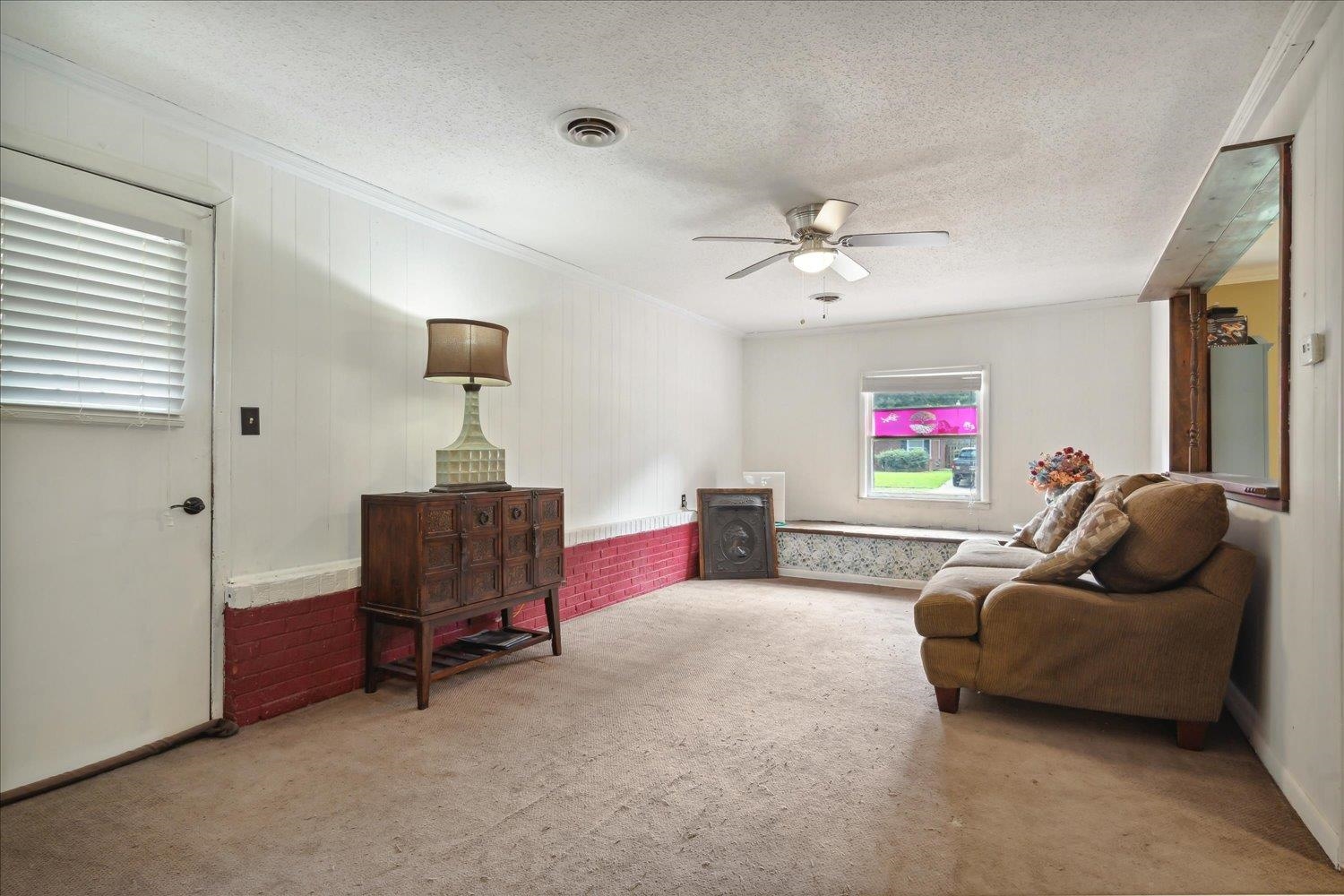 4608 Boyce Road Memphis, TN 38117 - Photo 7 of 30 a living room with furniture and a ceiling fan
