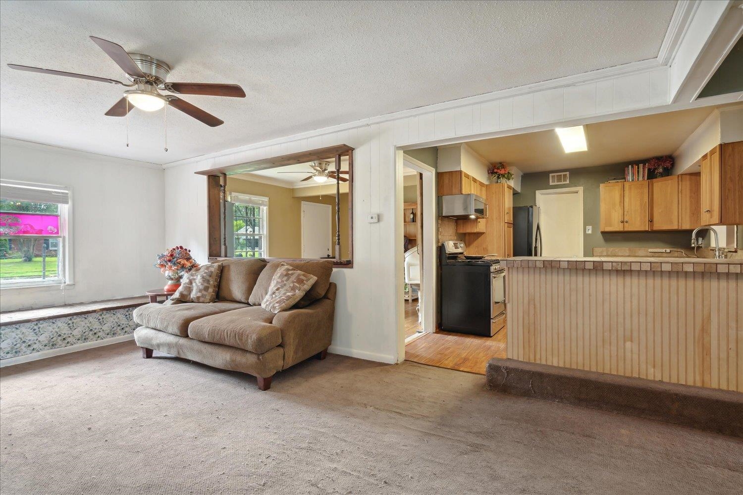 4608 Boyce Road Memphis, TN 38117 - Photo 8 of 30 a living room with furniture and a ceiling fan