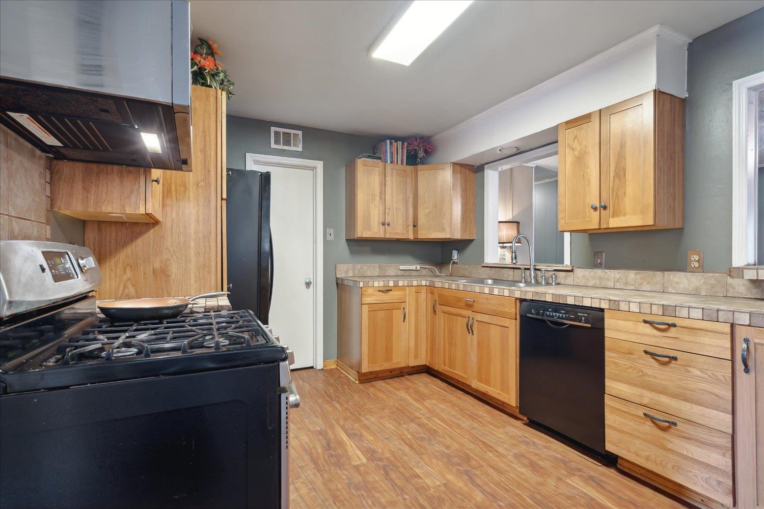 4608 Boyce Road Memphis, TN 38117 - Photo 10 of 30 a kitchen with stainless steel appliances granite countertop a stove and a refrigerator