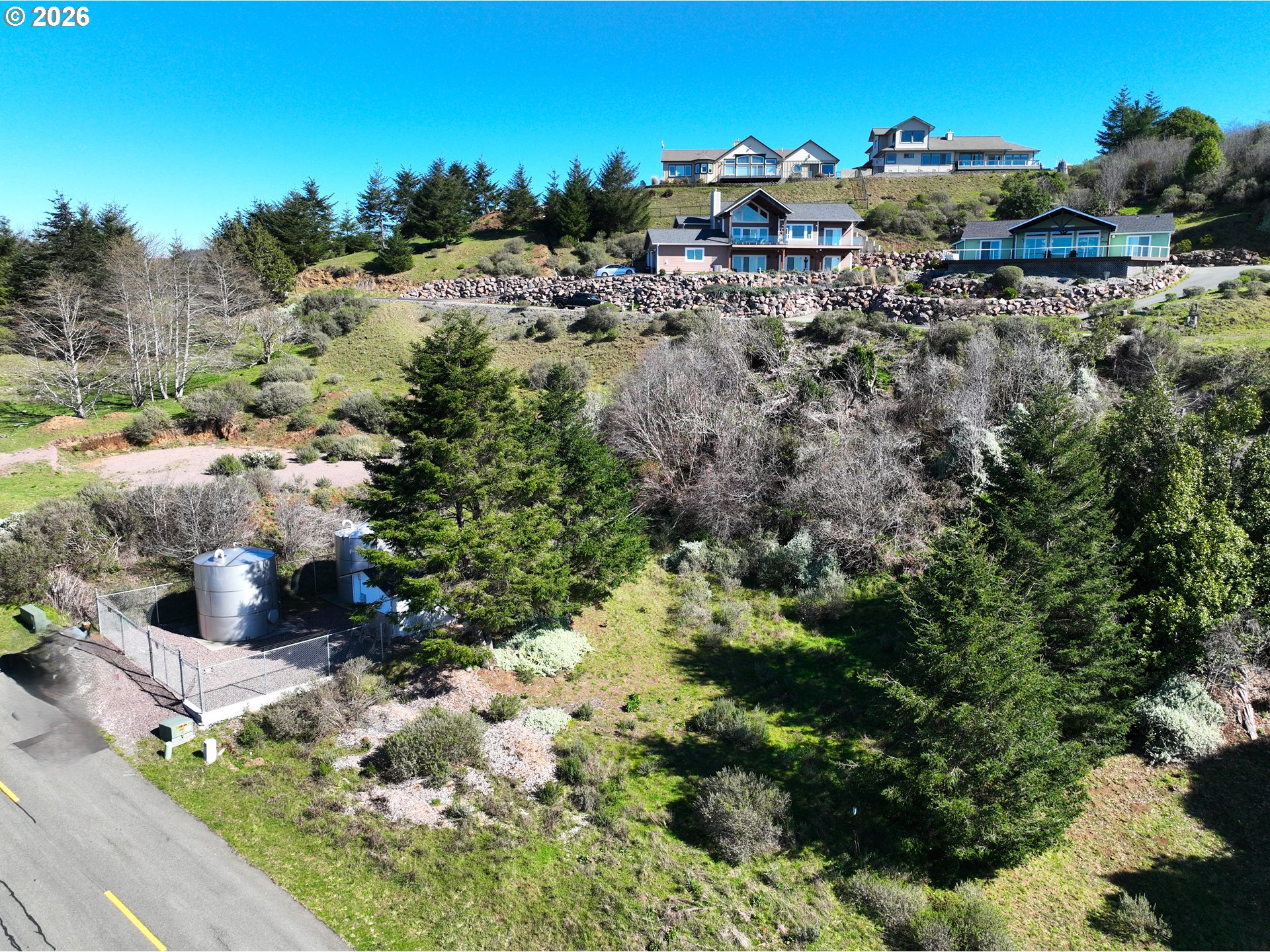 98007 Crown Terrace, Unit 7 Brookings, OR 97415 - Photo 3 of 18 a view of a houses with a yard