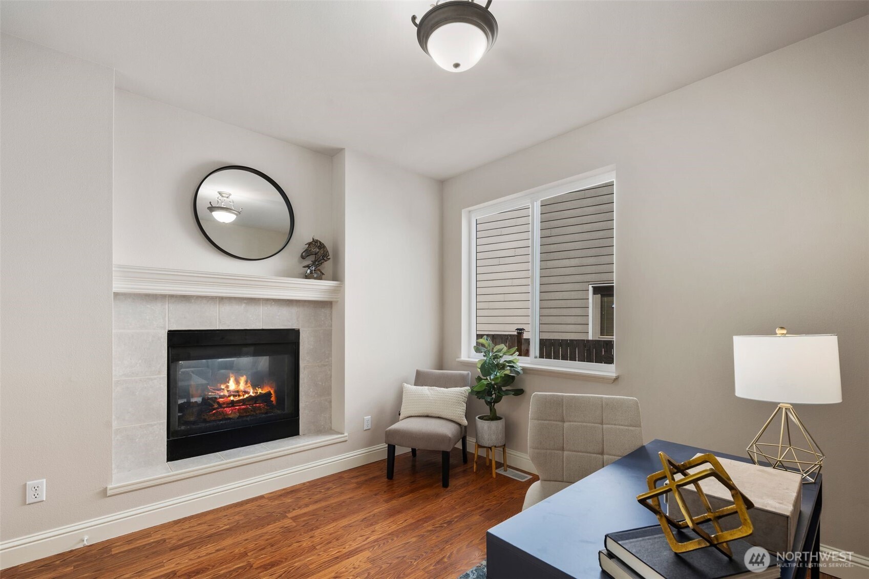 18523 173rd Street Southeast Renton, WA 98058 - Photo 16 of 40 a living room with furniture and a fireplace