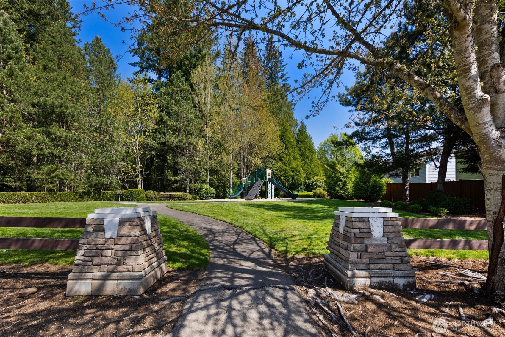 18523 173rd Street Southeast Renton, WA 98058 - Photo 36 of 40 a view of a garden with a bench