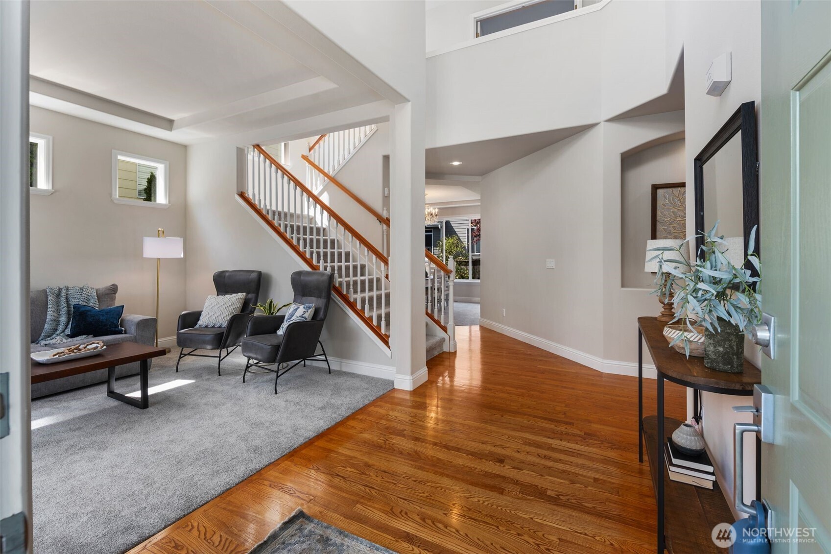 18523 173rd Street Southeast Renton, WA 98058 - Photo 5 of 40 a living room with furniture floor to ceiling window and wooden floor