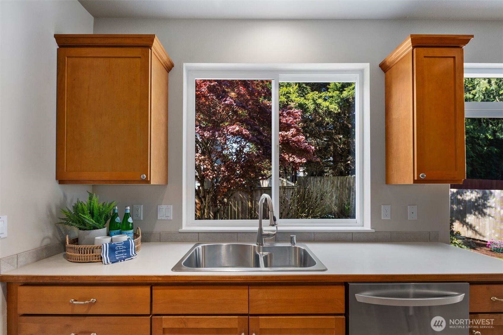 18523 173rd Street Southeast Renton, WA 98058 - Photo 9 of 40 a kitchen with a sink and a large window