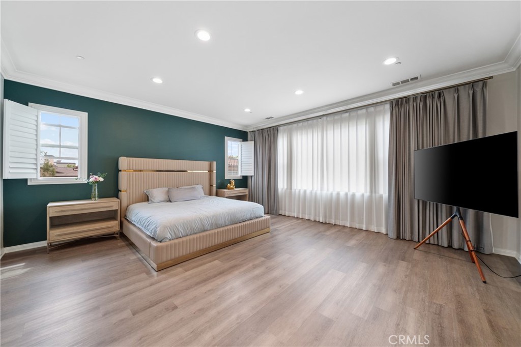 323 La Ventana Drive Brea, CA 92823 - Photo 17 of 47 a bedroom with a bed and a flat screen tv