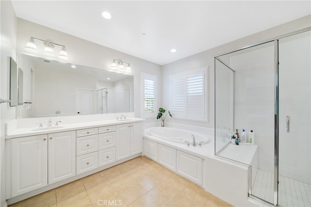 323 La Ventana Drive Brea, CA 92823 - Photo 20 of 47 a bathroom with a tub a sink double and mirror