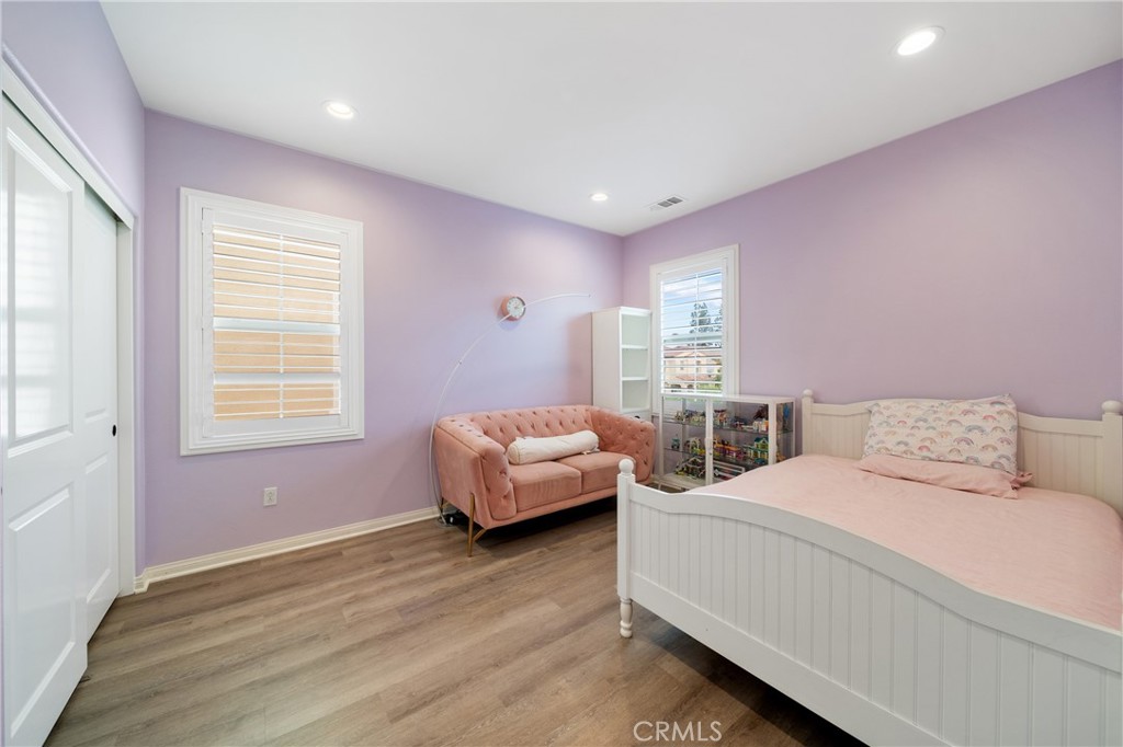 323 La Ventana Drive Brea, CA 92823 - Photo 25 of 47 a bedroom with a bed and wooden floor
