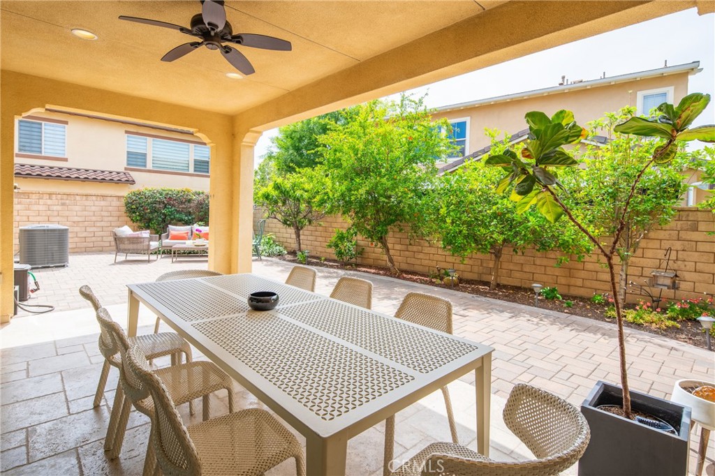 323 La Ventana Drive Brea, CA 92823 - Photo 28 of 47 a view of a patio with table and chairs potted plants with wooden floor