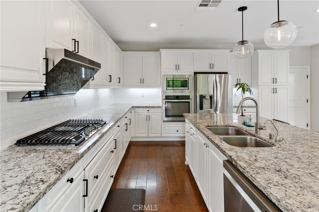 323 La Ventana Drive Brea, CA 92823 - Photo 3 of 47 a kitchen with granite countertop a sink a counter space appliances and cabinets
