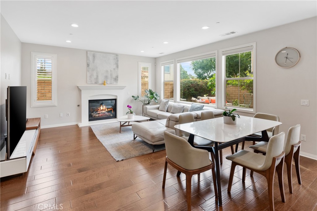 323 La Ventana Drive Brea, CA 92823 - Photo 8 of 47 a living room with furniture a table and a fireplace