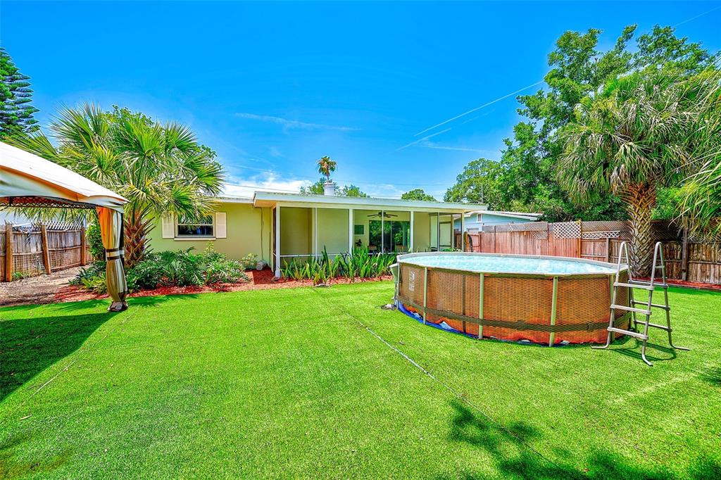 14079 Victoria Road Largo, FL 33774 - Photo 35 of 46 a view of an house with backyard space and garden