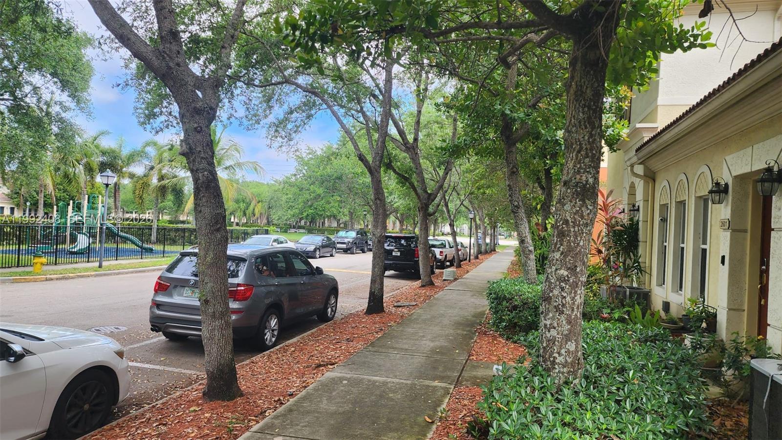 2607 Southwest 99th Way Miramar, FL 33025 - Photo 39 of 50 a view of a street with cars parked