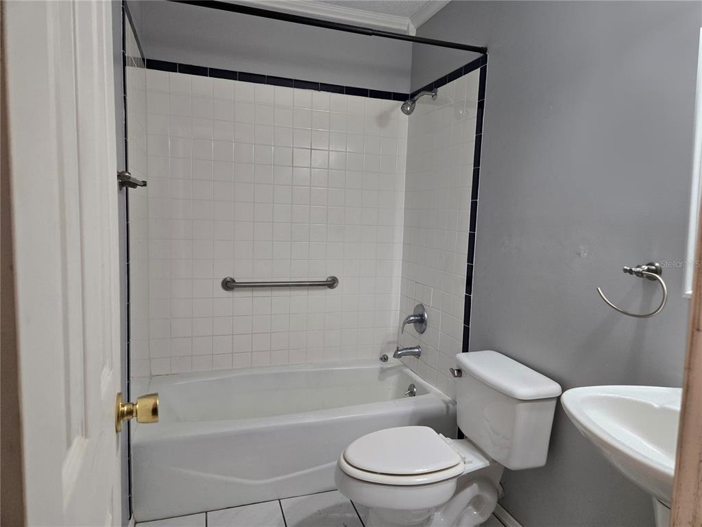 19 Spring Dr Place Ocala, FL 34472 - Photo 11 of 29 a bathroom with a toilet and a shower