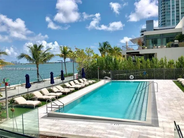 a view of a swimming pool with a patio