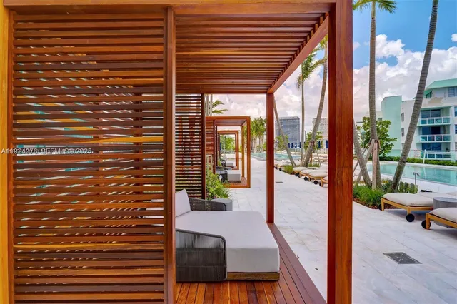 a view of a patio with couches and a table and chairs