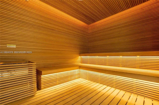 a room with pool table and windows