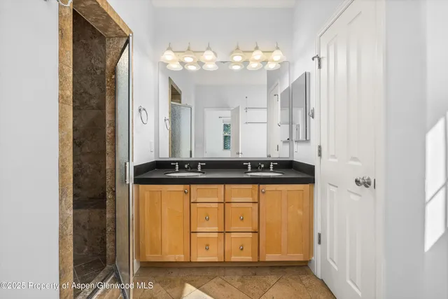 a bathroom with a sink a vanity and a mirror