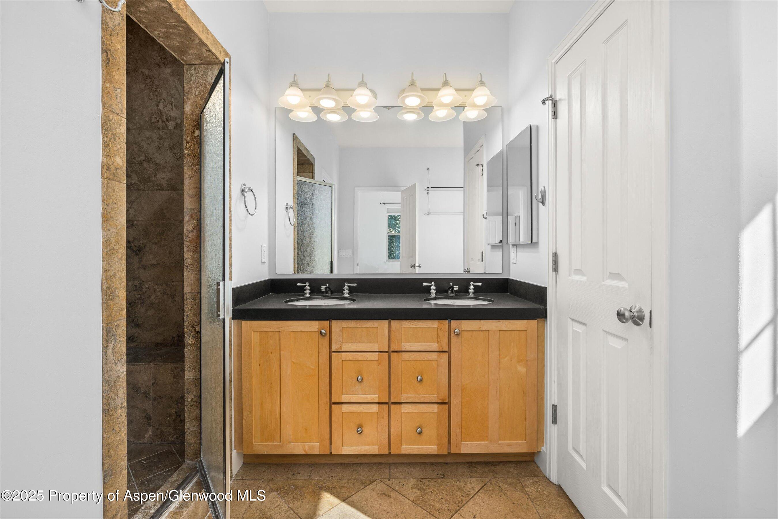 540 Evans Court Basalt, CO 81621 - Photo 16 of 24 a bathroom with a sink a vanity and a mirror