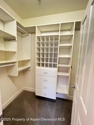 a view of an empty walk in closet