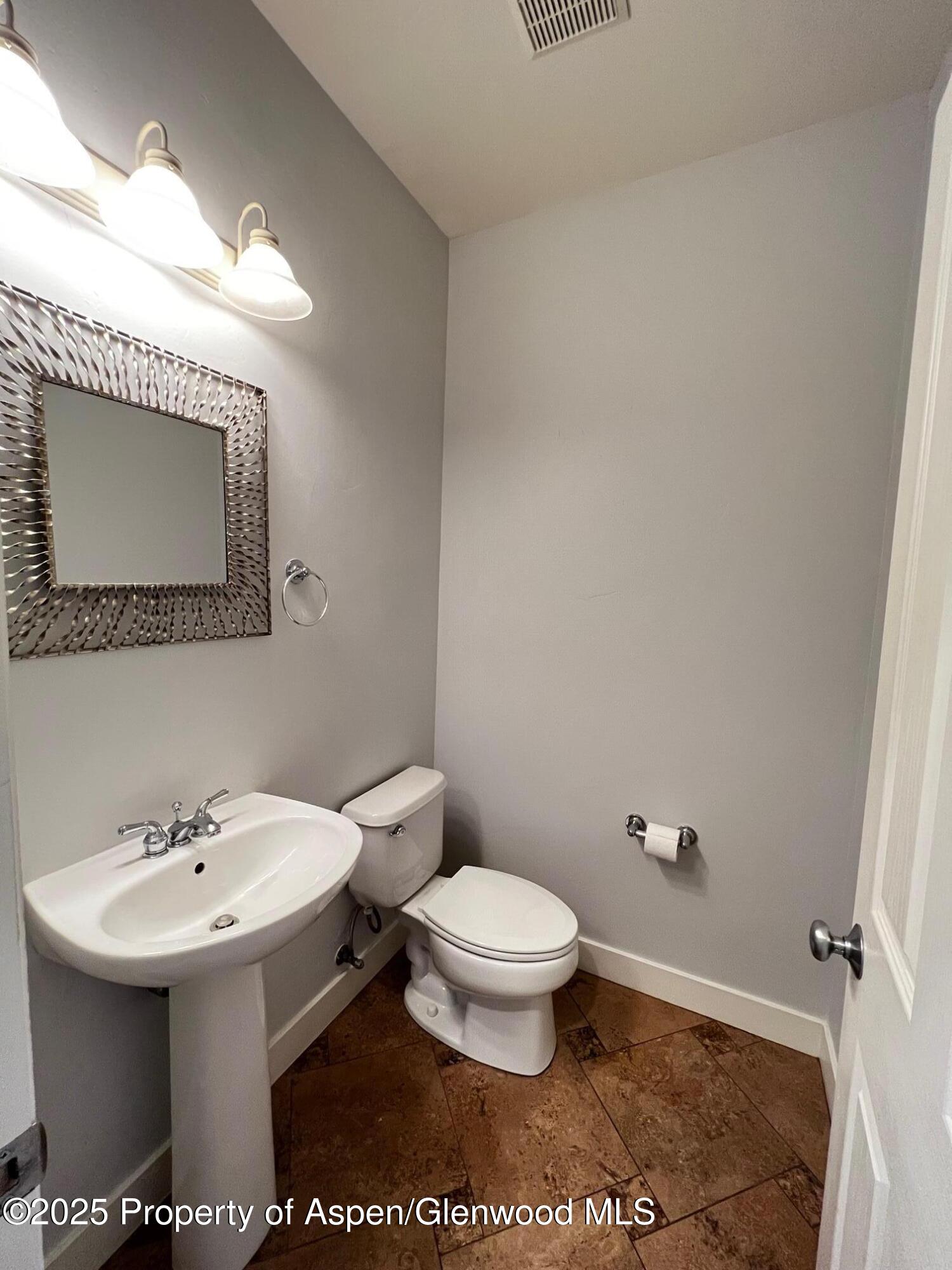 540 Evans Court Basalt, CO 81621 - Photo 18 of 24 a bathroom with a sink and a mirror