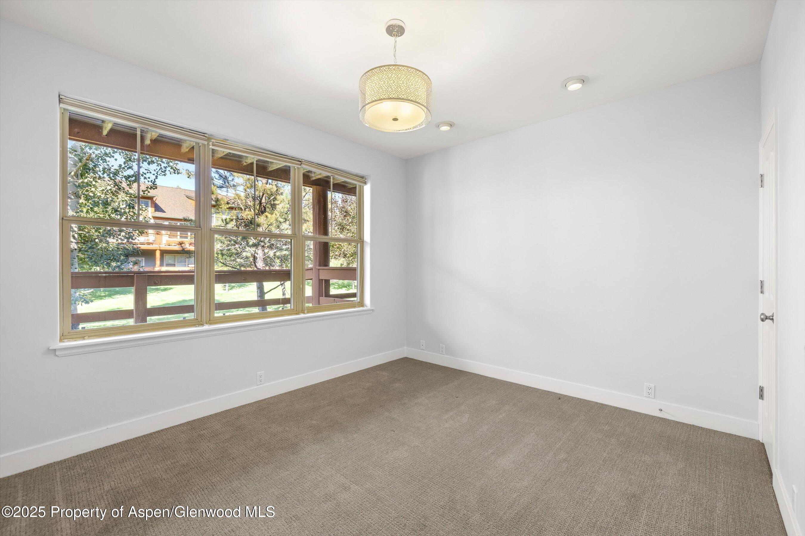 540 Evans Court Basalt, CO 81621 - Photo 21 of 24 a view of an empty room with a window