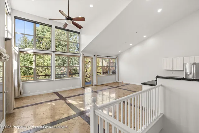 a bedroom with furniture and windows