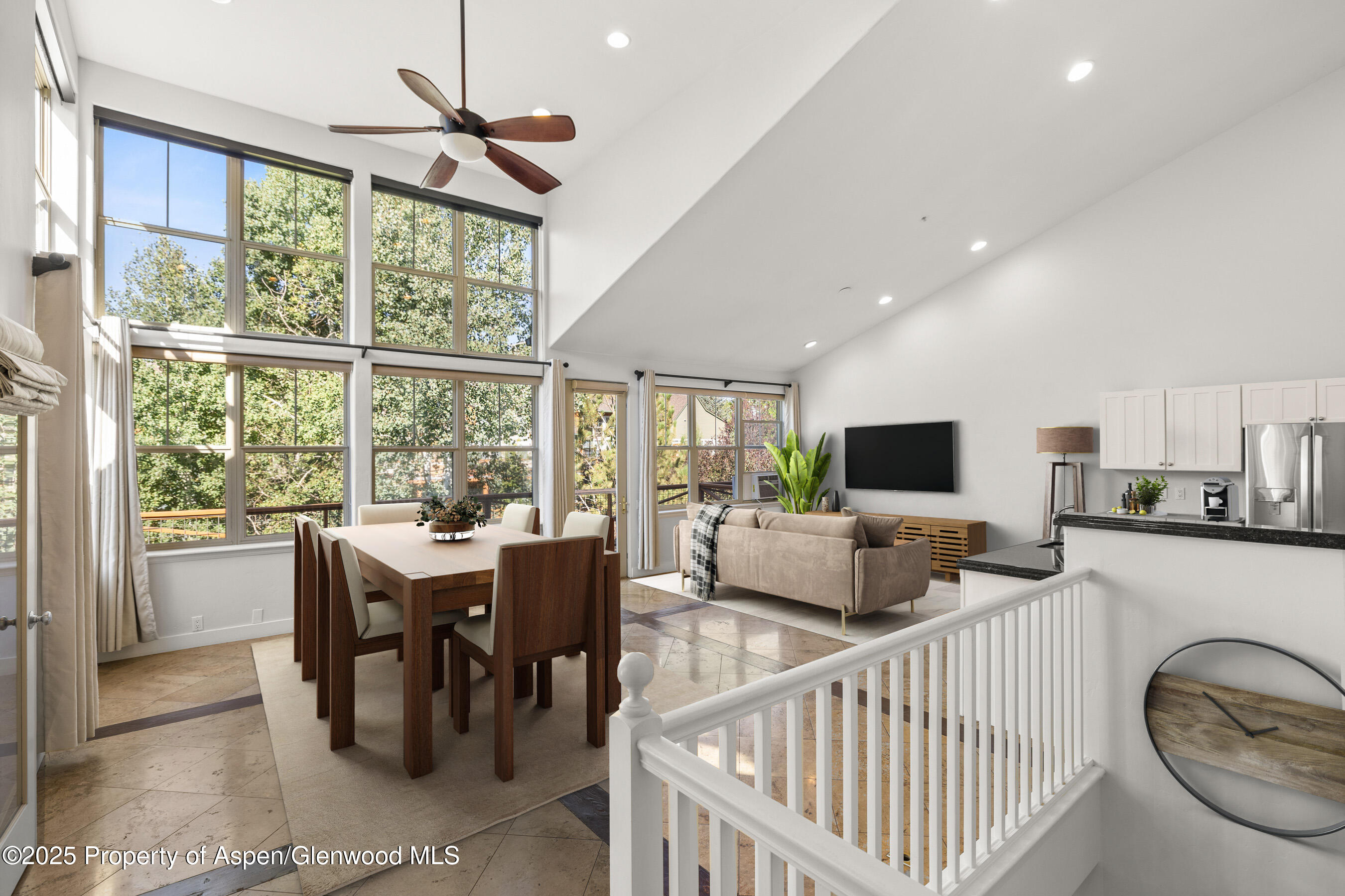 540 Evans Court Basalt, CO 81621 - Photo 5 of 24 a living room with furniture a flat screen tv and a large window