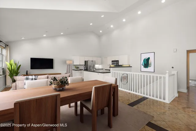 a dining room with furniture and a livingroom