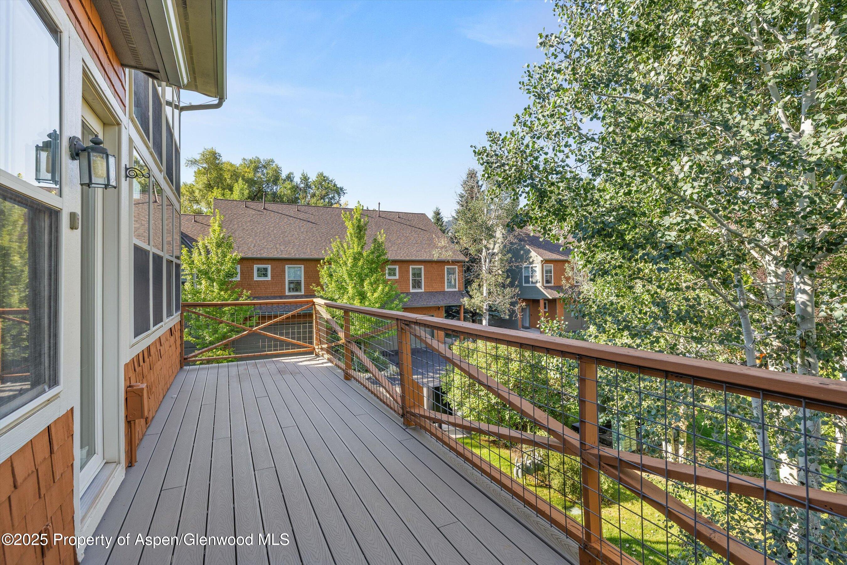 540 Evans Court Basalt, CO 81621 - Photo 9 of 24 a view of a balcony with wooden floor and fence