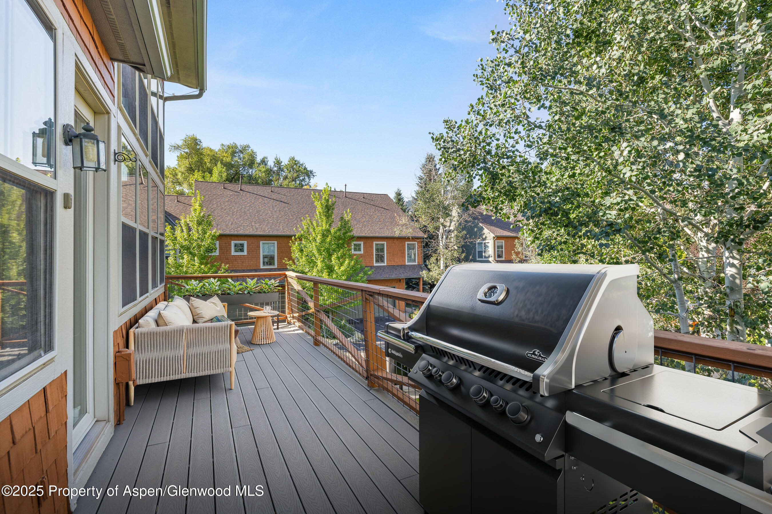 540 Evans Court Basalt, CO 81621 - Photo 10 of 24 a balcony with wooden floor and furniture