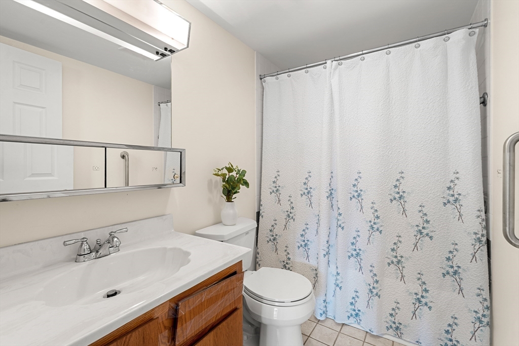 159 Main Street, Unit 11B Melrose, MA 02176 - Photo 11 of 33 a bathroom with a sink toilet and shower