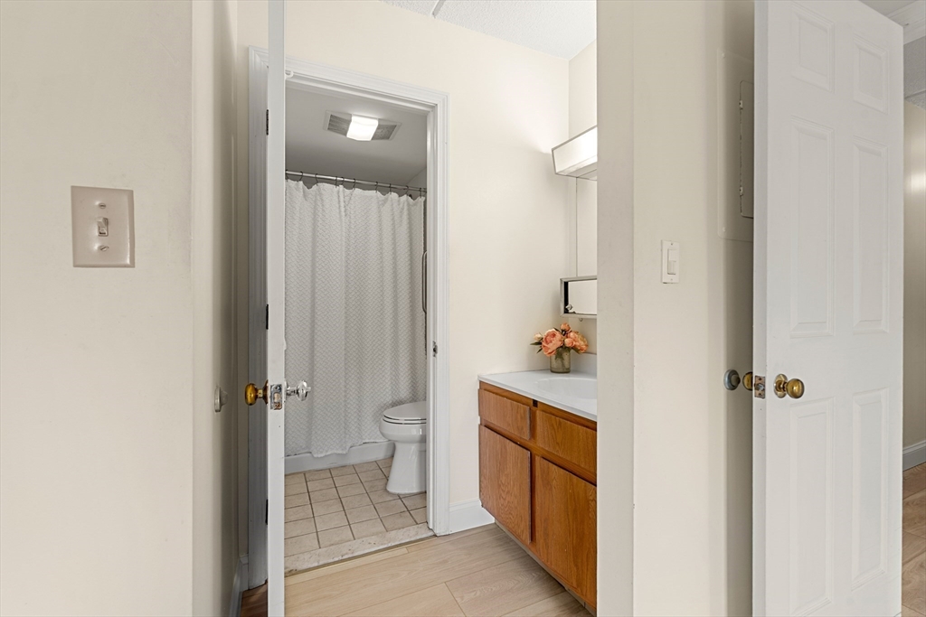 159 Main Street, Unit 11B Melrose, MA 02176 - Photo 19 of 33 a bathroom with a sink and a mirror