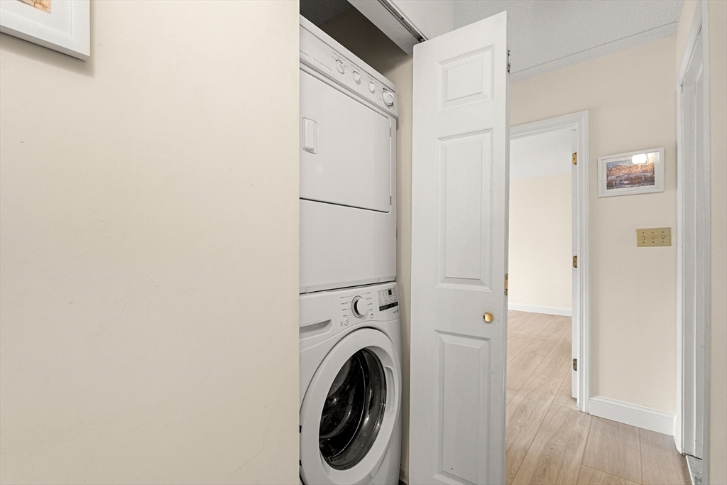 159 Main Street, Unit 11B Melrose, MA 02176 - Photo 20 of 33 a view of a hallway with washer and dryer
