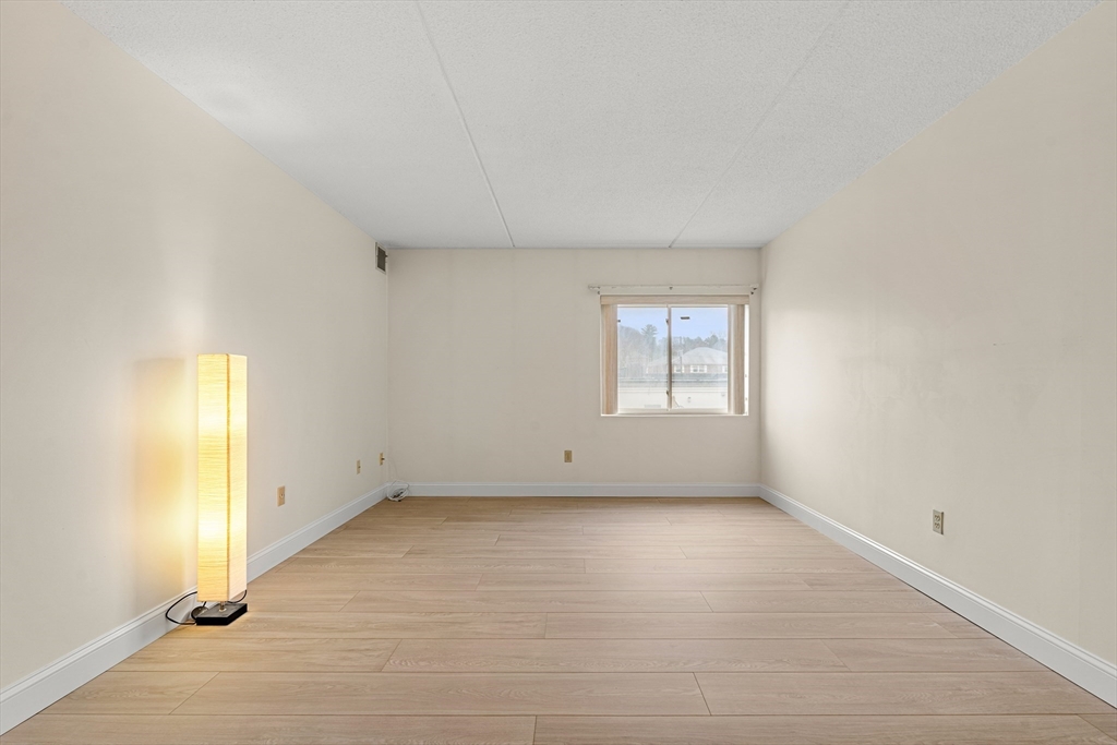 159 Main Street, Unit 11B Melrose, MA 02176 - Photo 2 of 33 an empty room with windows