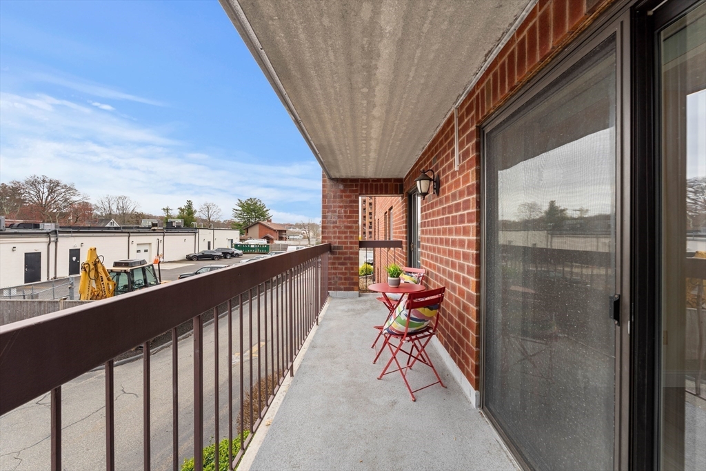 159 Main Street, Unit 11B Melrose, MA 02176 - Photo 21 of 33 a view of a balcony with furniture