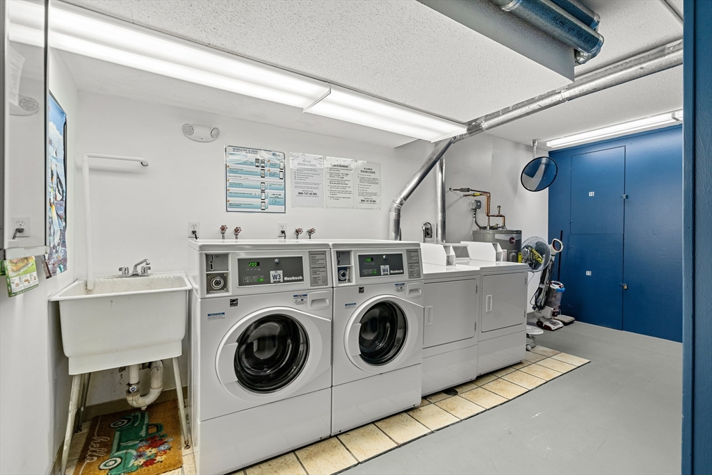 159 Main Street, Unit 11B Melrose, MA 02176 - Photo 28 of 33 a utility room with dryer and washer