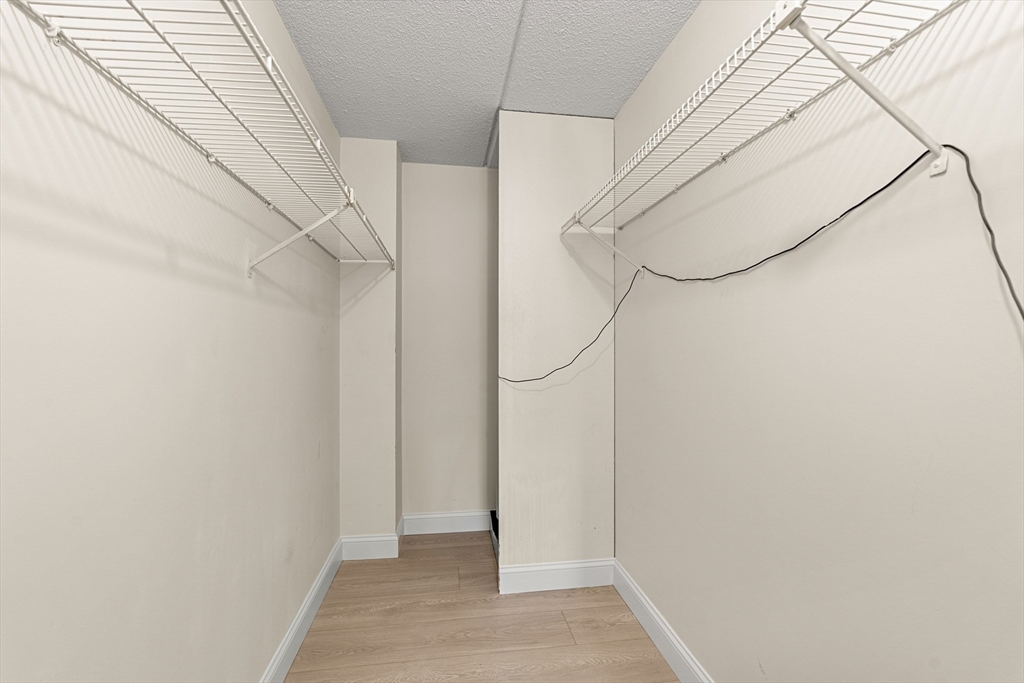 159 Main Street, Unit 11B Melrose, MA 02176 - Photo 4 of 33 a view of small space with racks on the wall