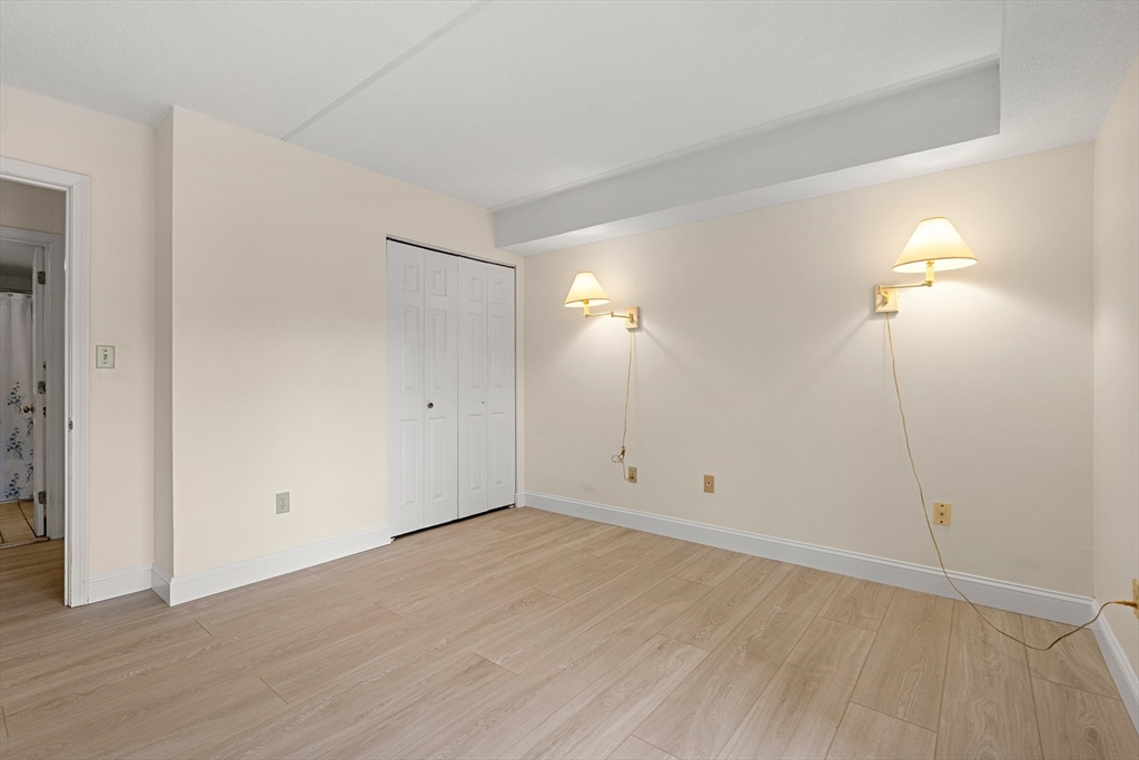 159 Main Street, Unit 11B Melrose, MA 02176 - Photo 10 of 33 wooden floor in an empty room