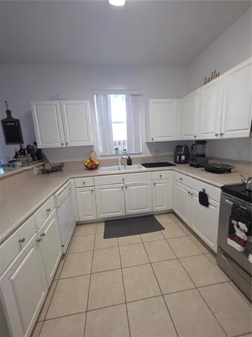 a view of a dining room and livingroom with furniture