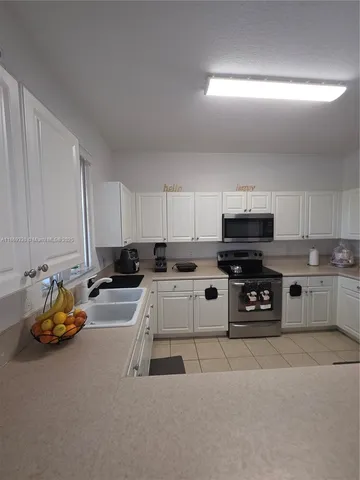 a bed room with a bed and a chair