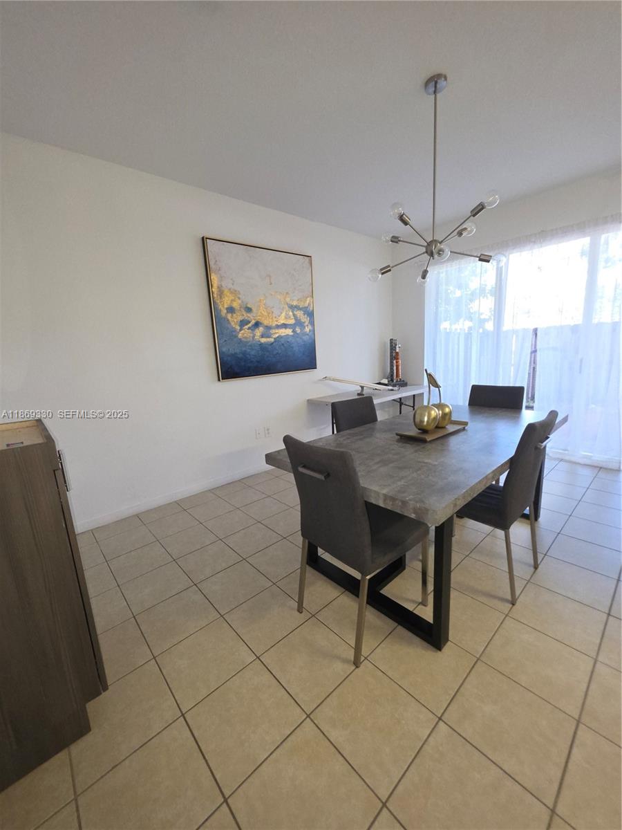 13236 Southwest 128th Street Miami, FL 33186 - Photo 15 of 41 a view of a dining room and livingroom with furniture